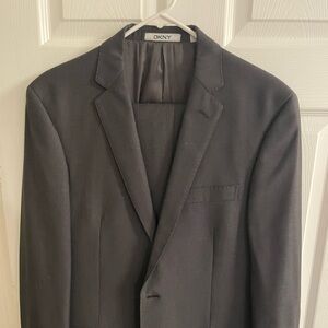 DKNY tailored Men’s suit. 42 regular. Tailored to fit 6’1, 190 pound male.